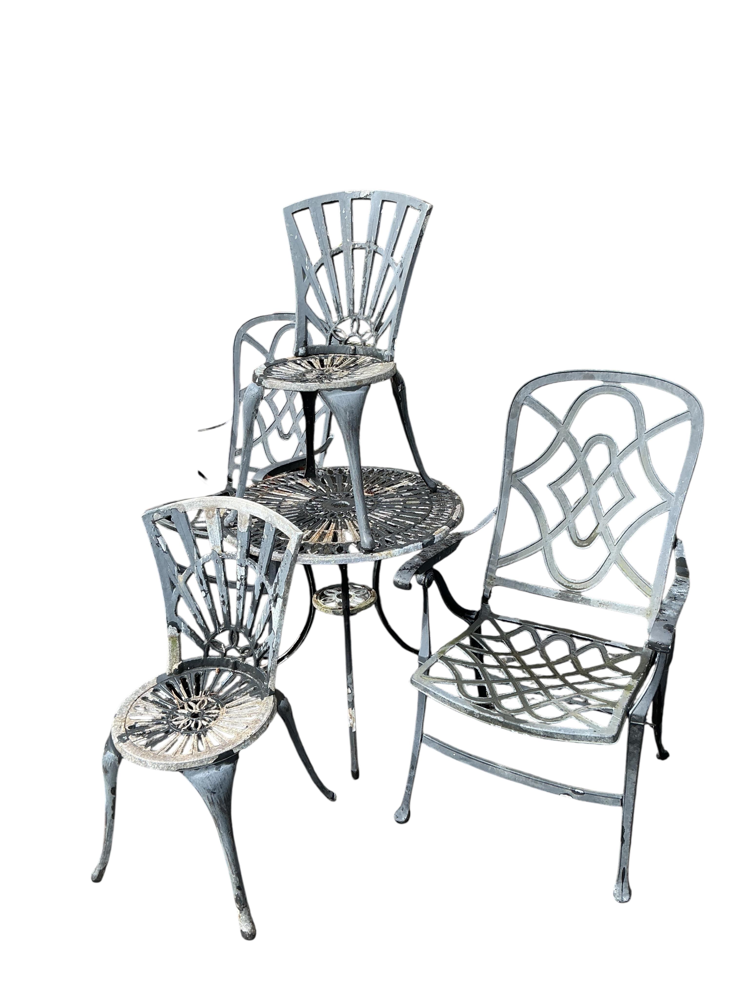 An aluminium garden bistro set and two metal folding garden chairs